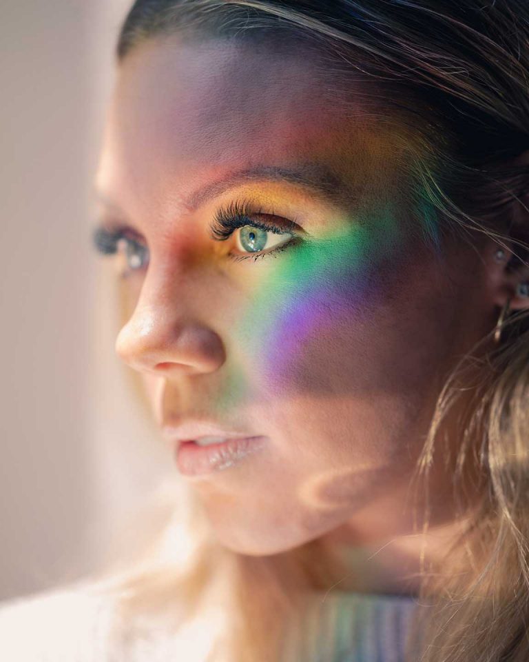 Girl with rainbow on her face